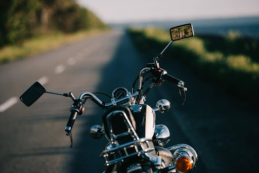 Behind the handlebars of a motorcycle on the open road. Behind the handlebars of a motorcycle on the open road.