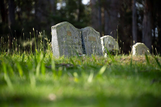 A pair of headstones in a cemetery; a wrongful death claim can help compensate for funeral costs. A pair of headstones in a cemetery; a wrongful death claim can help compensate for funeral costs.