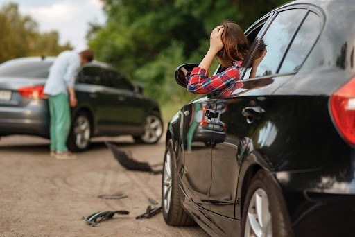 Zavodnick & Lasky Personal Injury Lawyers | Accidents In Philadelphia Caused By Blind Spots A woman and a man in the aftermath of a sideswipe collision, one of the common accidents caused by blind spots.