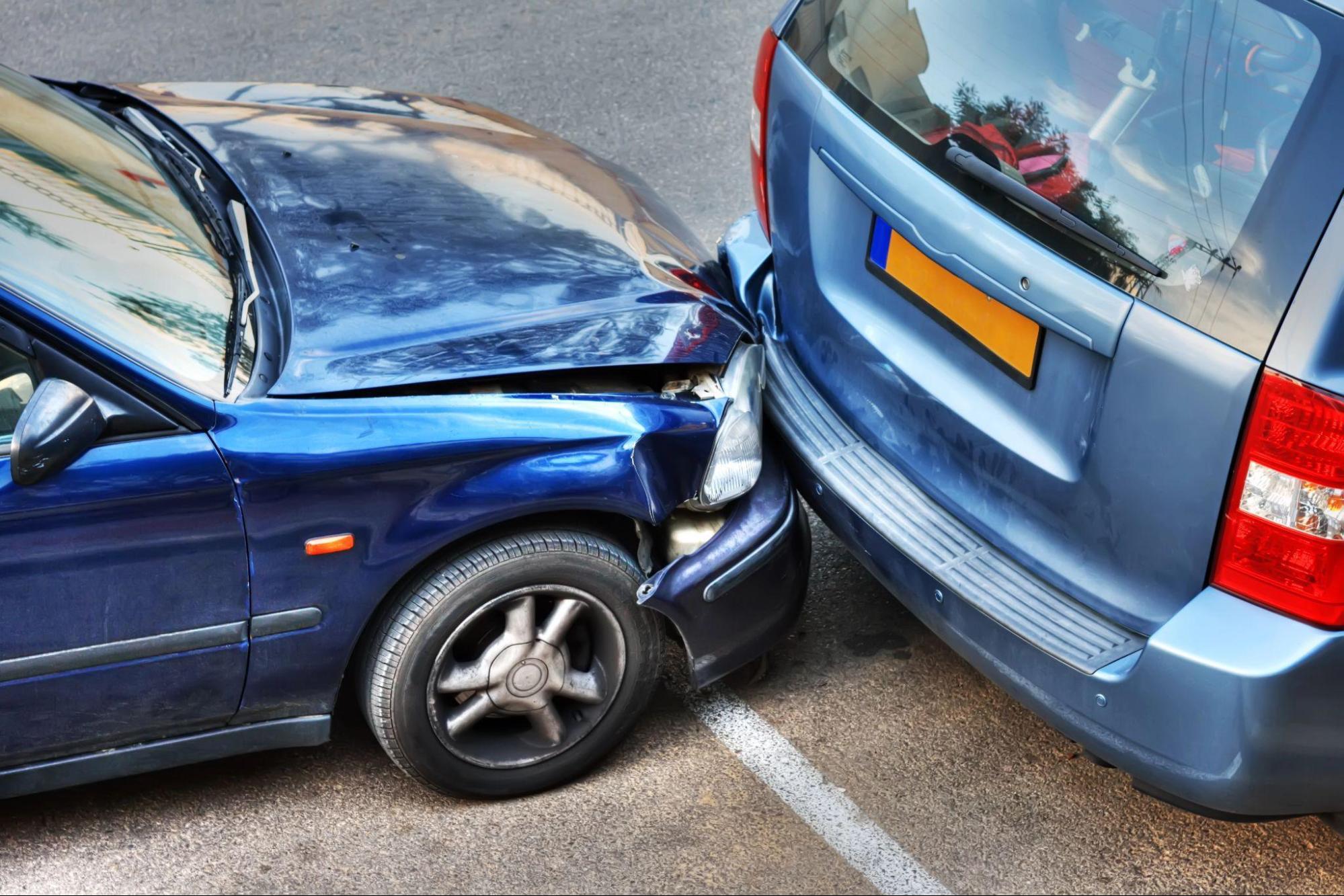 image3 A sedan and a minivan sit idle after an unexpected rear-end accident; a car accident lawyer can help navigate the aftermath of such an accident
