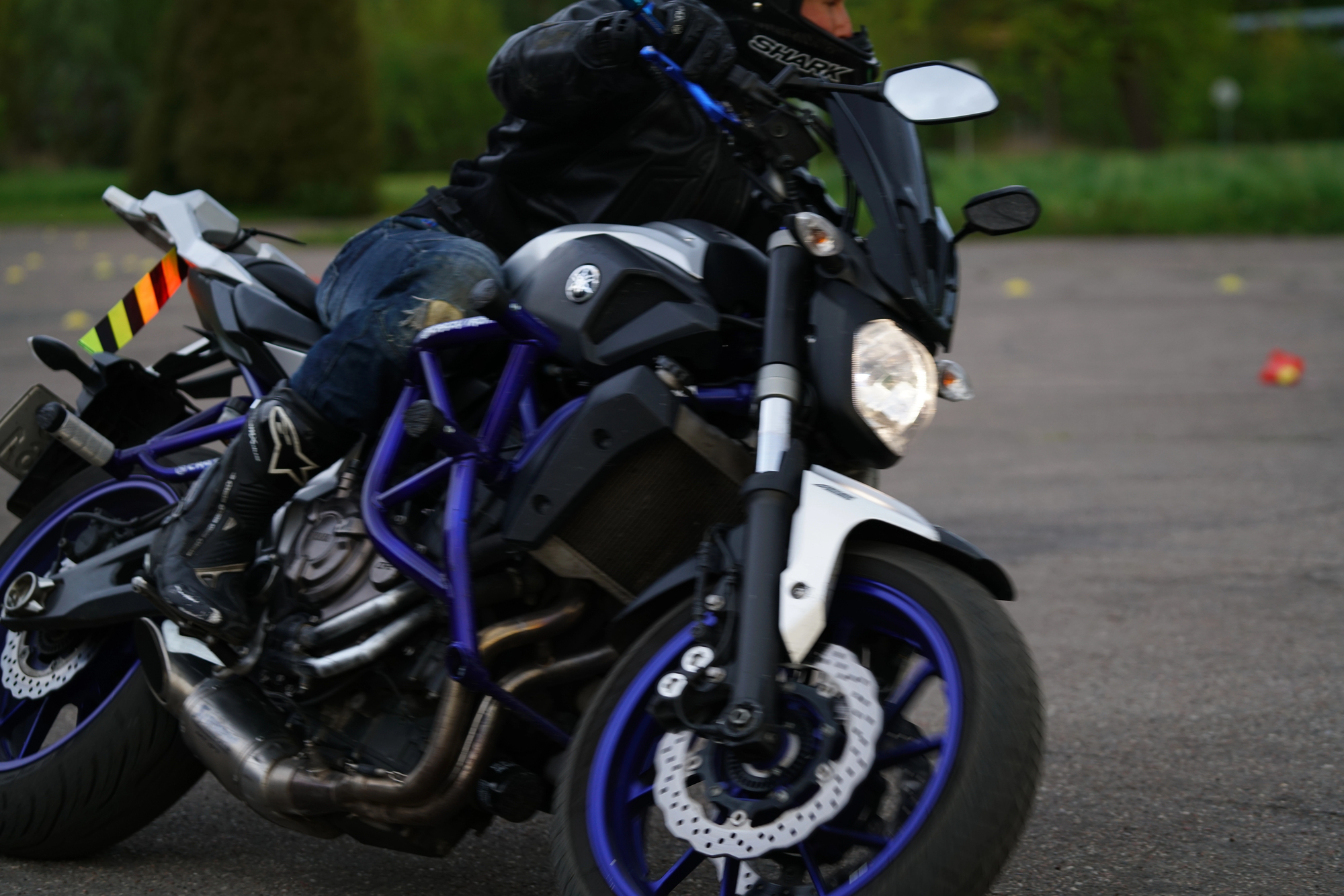 image3 A cyclist riding a motorbike, displaying where a motorcycle crash bar or engine guard might be installed.